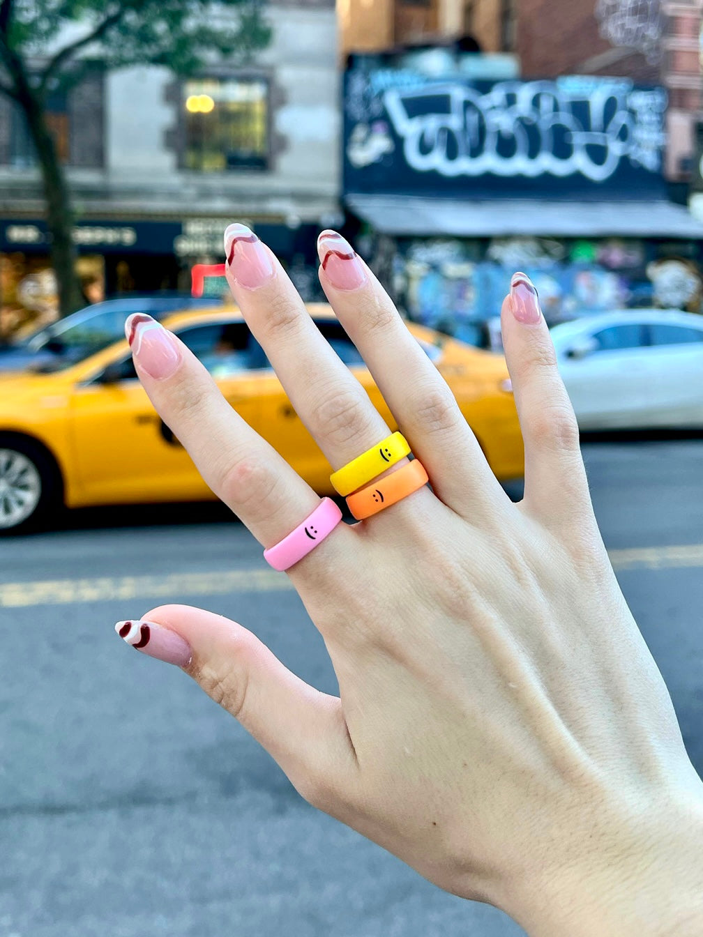 Flip Reversible smile / frown ring neon orange